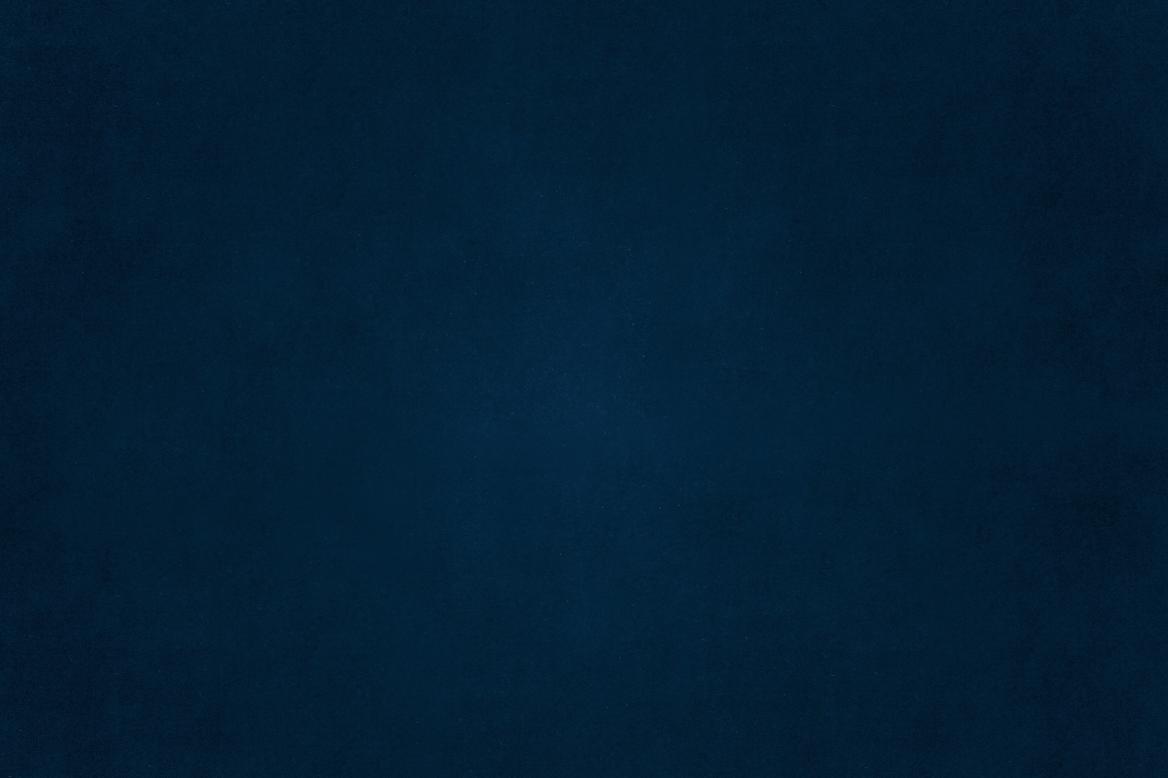 Black and white photo of a women performing modern dance on a dark background.